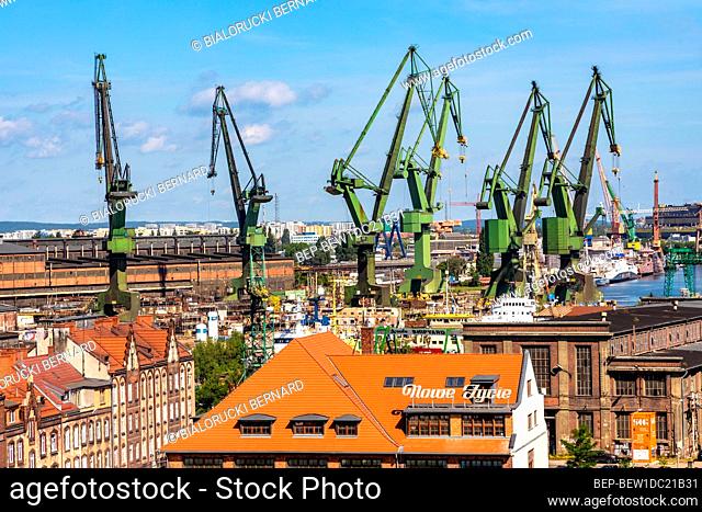 Gdansk, Pomerania / Poland - 2020/07/14: Panoramic view of Gdansk Shipyard industrial infrastructure near European Solidarity Centre building at Solidarnosci...