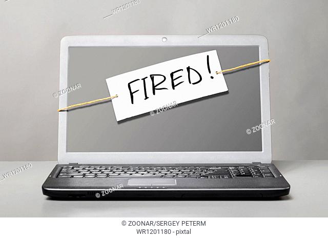 laptop with fired note