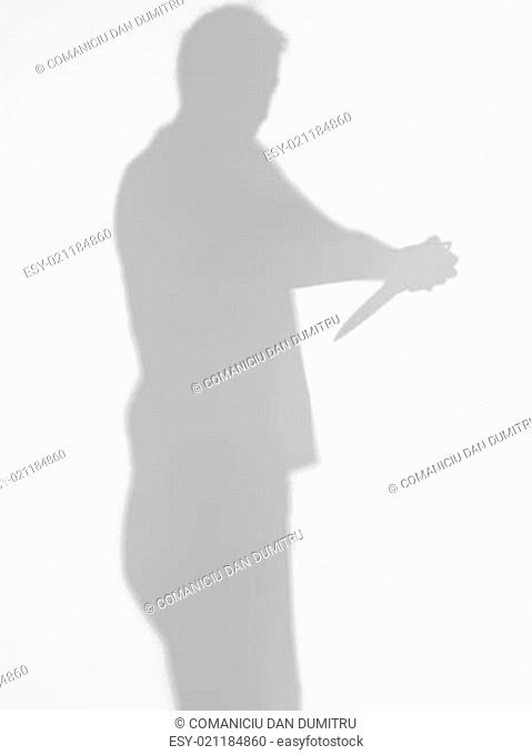 man silhouette trying to commit suicide, with knife
