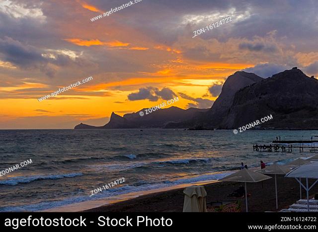 Sunset in the bay of the resort town of Sudak. Crimea