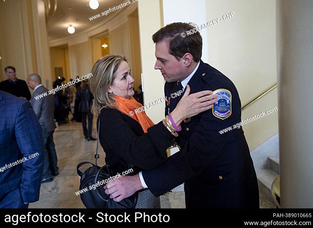 Metropolitan Police Officer Daniel Hodges, right, embraced by United States Representative Madeleine Dean (Democrat of Pennsylvania) as he waits to depart...