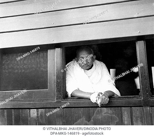 Mahatma Gandhi looking out of a train window , 1945 , India NO MR