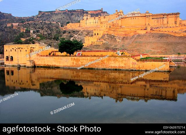 Amber Fort reflected in Maota Lake near Jaipur, Rajasthan, India. Amber Fort is the main tourist attraction in the Jaipur area