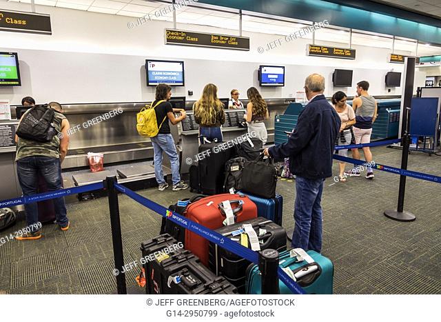 Florida, Miami, MIA, Miami International Airport, terminal, TAP Air Portugal, airline carrier, ticket counter, luggage, check-in, line, queue, passenger