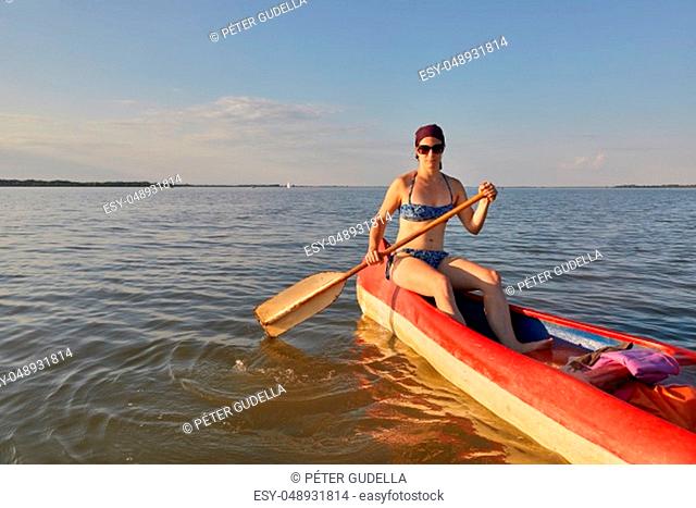 Canoeing in late afternoon sunlight, Lake Tisza, Hungary