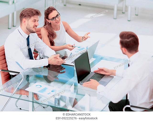 Three successful business person working. High view