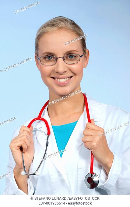 Close-up of a beautiful young female doctor smiling
