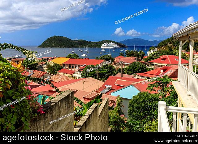 View to beautiful Les Saintes Bay across red roofs of town, Terre de Haut, Iles Des Saintes, Guadeloupe, Leeward Islands, West Indies, Caribbean