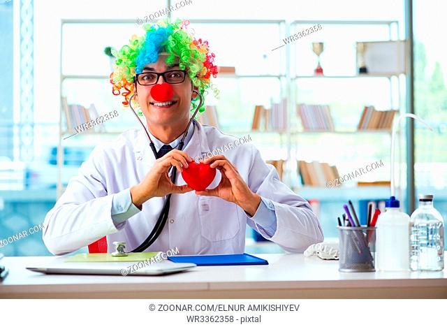 Child cardiologist with stethoscope and red heart