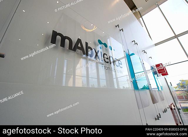 07 April 2022, Argentina, Garin: View of the mAbxience pharmaceutical company logo at the entrance to its facility. The facility produces 3 million doses of...