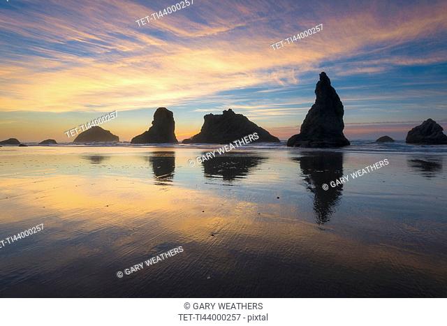 Beach with stack rocks at sunset