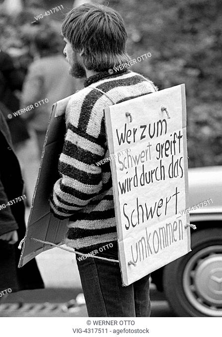 Eighties, black and white photo, people, peace demonstration, Easter marches 1983 in Germany against nuclear armament, young man presents a protest sign