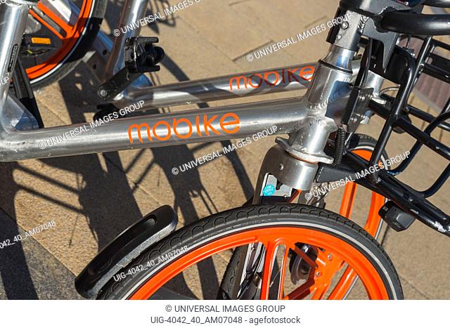 Mobike, founded by Beijing Mobike Technology Co., Ltd., is a fully station-less bicycle-sharing system. Bikes seen in Cambridge, England, UK