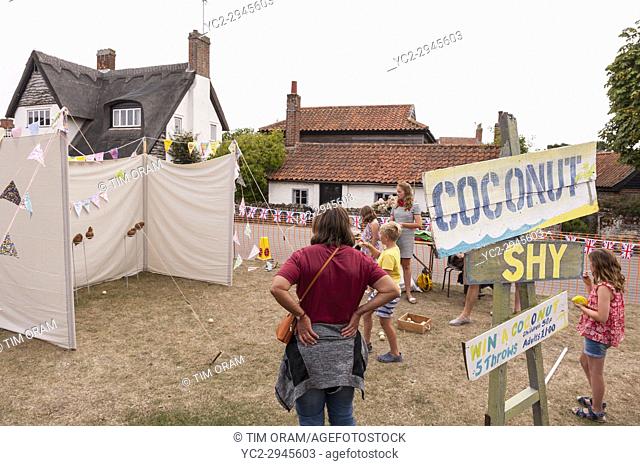 The Coconut shy at the village fete in Walberswick , Suffolk , England , Britain , Uk