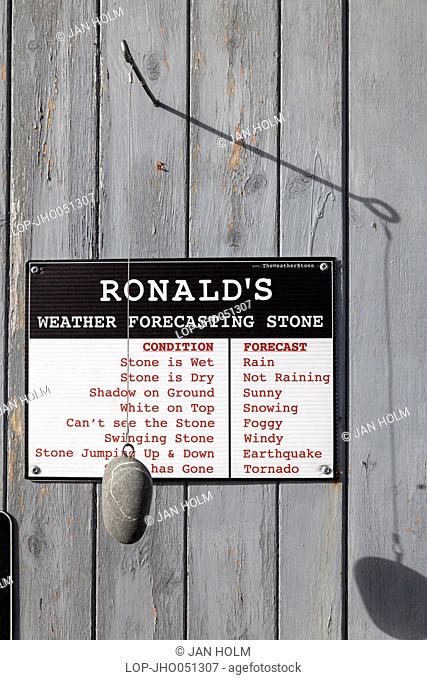 Scotland, Highland, Cromarty. Weather forecasting stone at Cromarty pier