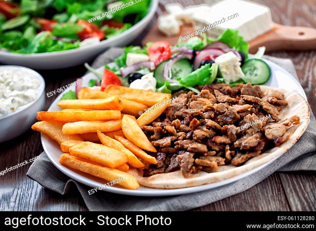 Greek Gyros with Fries and Salad on a Plate