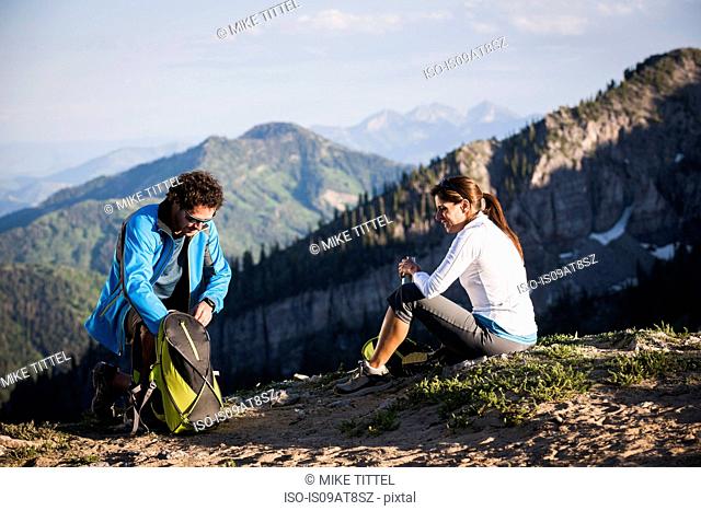 Hikers taking break, Sunset Peak trail, Catherine's Pass, Wasatch Mountains, Utah, USA