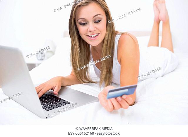 Blonde woman buying on website
