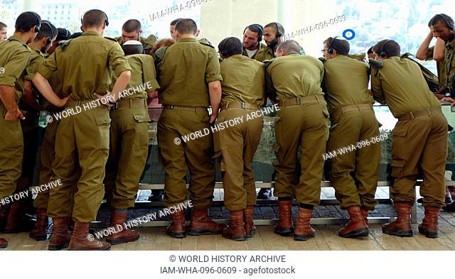 Young Israeli soldiers visiting the Holocaust Memorial at Yad Vashem in Jerusalem as part of their conscript service