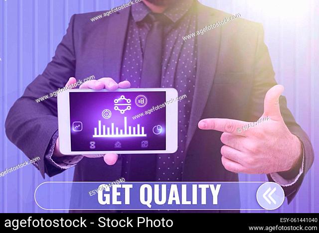 Sign displaying Get Quality, Concept meaning features and characteristics of product that satisfy needs Man holding Screen Of Mobile Phone Showing The...