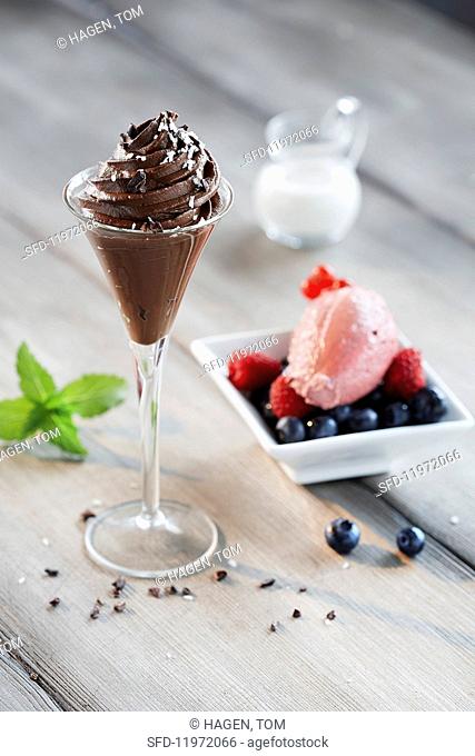Mousse au chocolat and strawberry mousse with berries