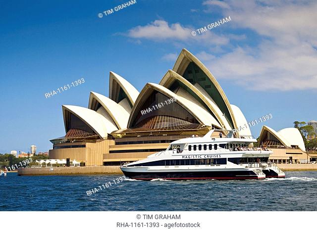 Power boat passes Sydney Opera House in Sydney Harbour, Australia