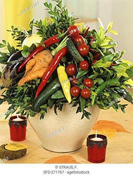 Arrangement of vegetables with sprigs of box