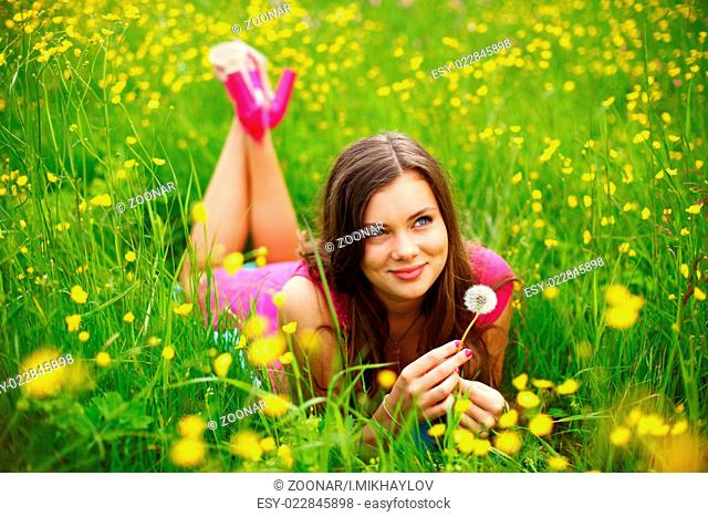 summer woman blow on dandelion