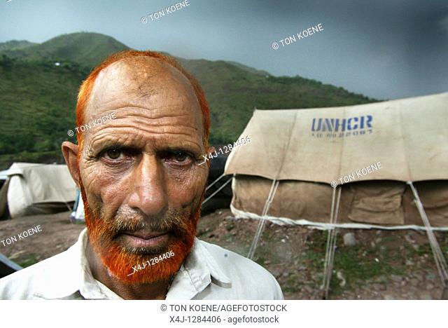 A Pakistani man in a makeshift camp  An earthquake hit Pakistan in October 2005, destroying hundreds of villages and claiming thousands of lives  Emergency...
