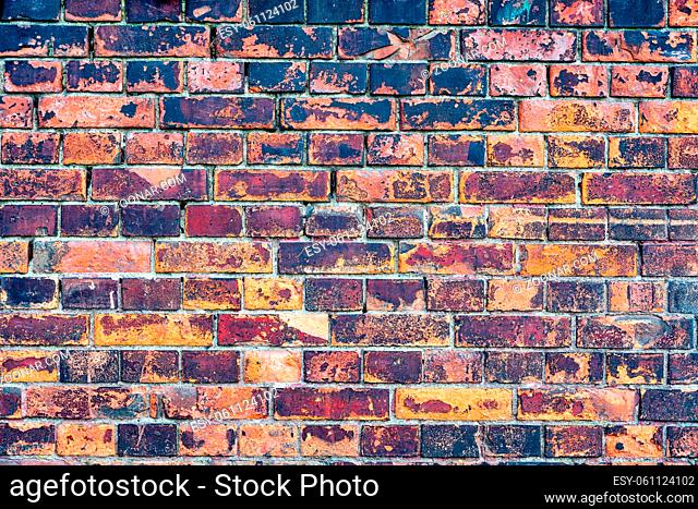 Old, rustic red corroded and damaged brick wall. High quality texture and background for your projects and creative work