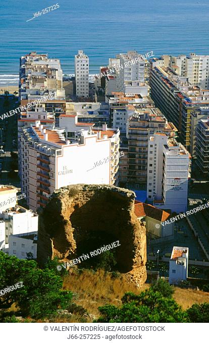 View of Cullera, with the remains of a tower and blocks of apartaments at the background. Valencia. Spain