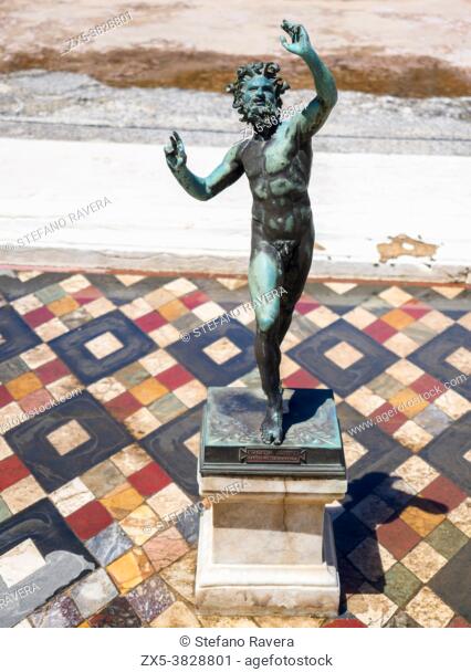 Bronze statue of a dancing faun in the House of the Faun (Casa del Fauno) - Pompeii archaeological site, Italy