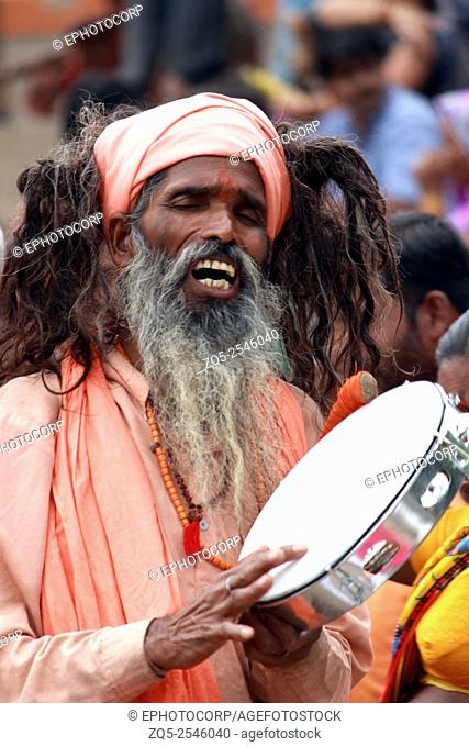 Sadhu singing bhajans Kumbh Mela, Nasik, Maharashtra, India