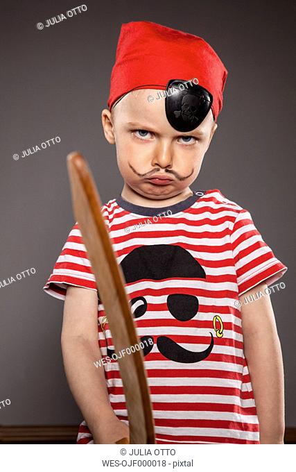 Portrait of angry looking little boy dressed as pirate