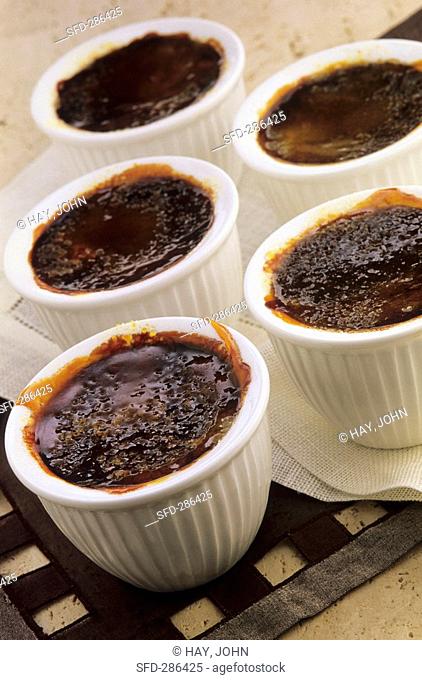 Caramelised chocolate cream in several small pots