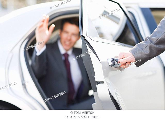 Politician emerging from limo