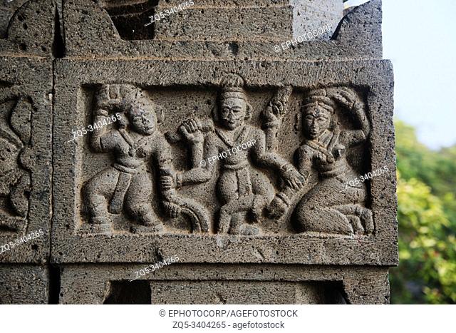 Male and female figures carved on huge stone pillar, Sangmeshwar Temple in Saswad, Pune District, Maharashtra, Pune