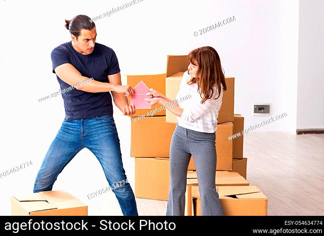 Young pair and many boxes in the divorce settlement concept