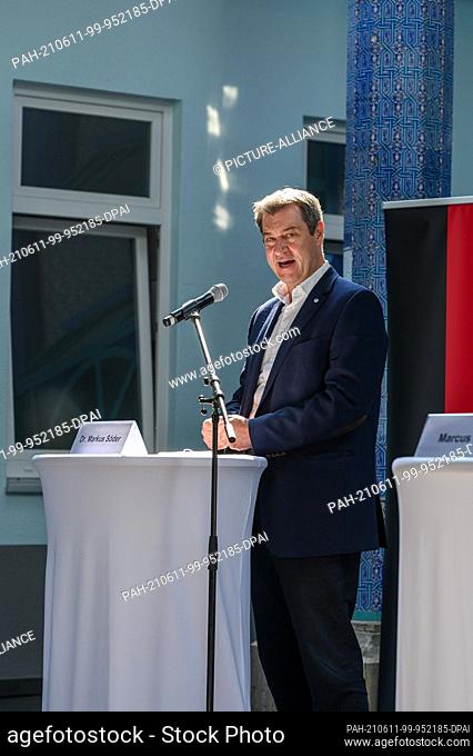10 June 2021, Bavaria, Nuremberg: Markus Söder (CSU), Prime Minister of Bavaria, during his welcoming speech in the courtyard of the Eyüp Sultan Mosque