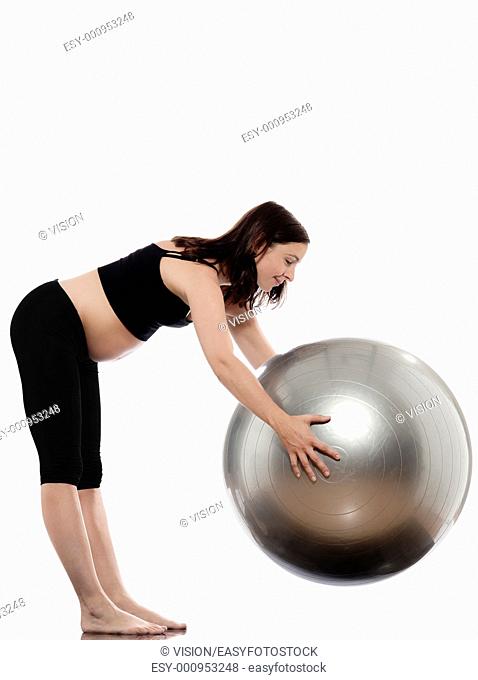 pregnant caucasian woman stretching with fitness ball isolated studio on white background