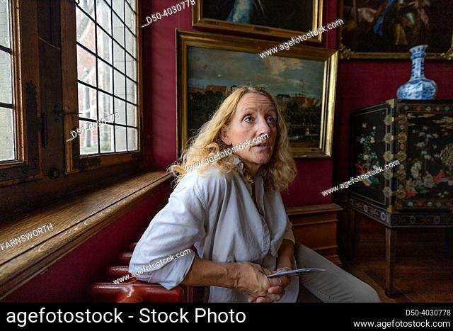 Hillerod, Denmark A woman tourist sits in the Frederiksborg Castle from the 17th century and built by King Christian IV