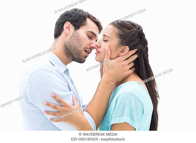 Attractive young couple about to kiss