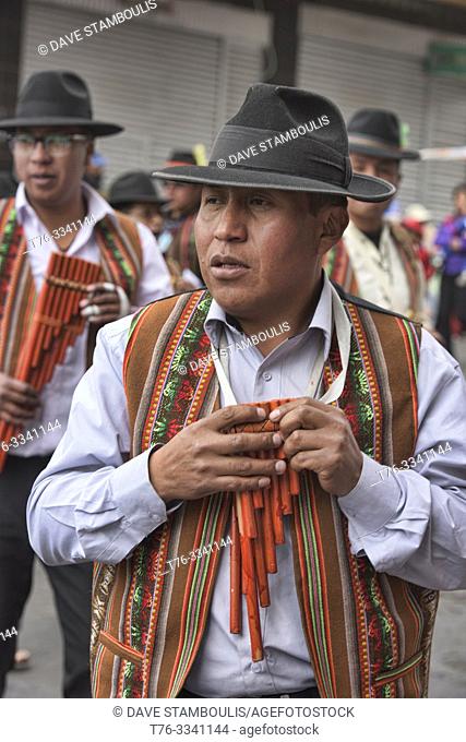 Kollasuyo man playing a siku (panpipe) at the Gran Poder Festival, La Paz, Bolivia