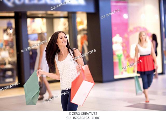 Young women on shopping spree in mall