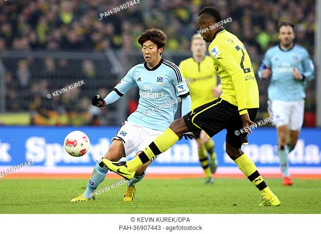 Hamburg's Heung-Min Son (L) vies for the ball with Dortmund's Felipe Santana during the Bundesliga soccer match between Borussia Dortmund and Hamburger SV at...