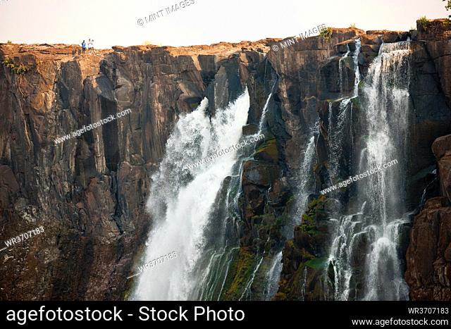 Victoria Falls, huge waterfalls of the Zambezi river flowing over sheer cliffs