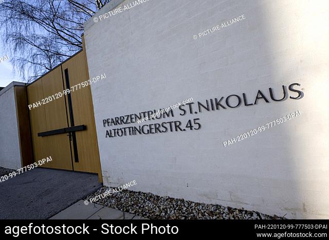 13 January 2022, Bavaria, Garching An Der Alz: The lettering ""Pfarrzentrum St. Nikolaus - Altöttingerstr. 45"" can be seen next to the entrance gate to the...