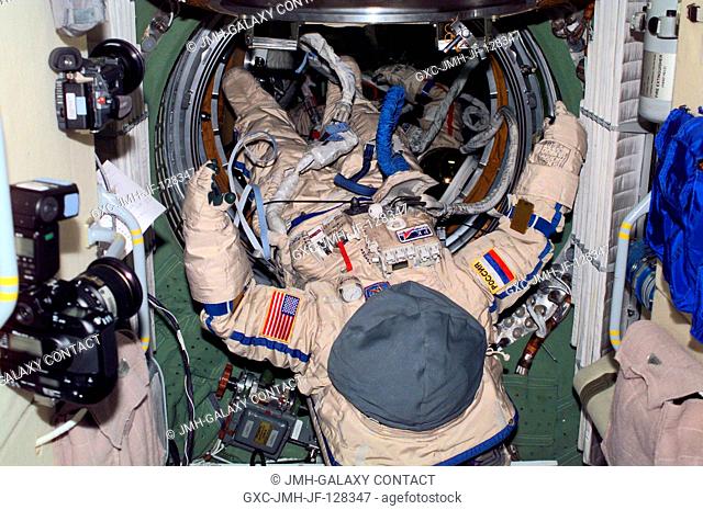 View of two Orlan spacesuits in the aft section of the Zarya module or Functional Cargo Block. The suits are scheduled to be used in the June 8 space walk