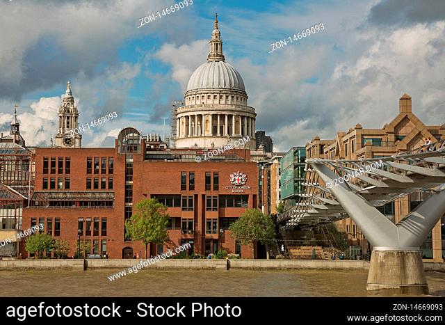 LONDON, UK - SEPTEMBER 08, 2017: St Pauls Cathedral and the Millennium Bridge in London, United Kingdom during a cloudy day