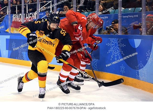 25 Febuary 2018, South Korea, Gangneung: Olympics, Ice Hockey, finals, OAR vs Germany, Gangneung Hockey Centre: Germany's Felix Schuetz (L-R) in action against...